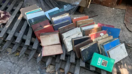Ukraine_Damaged books layed out on wooden pallette