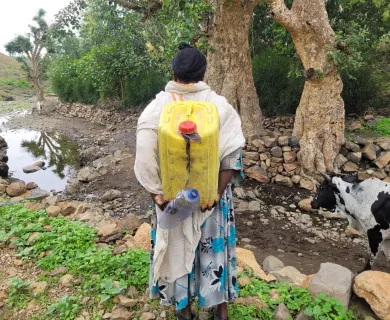 Ethiopia_Woman carrying water container on her back