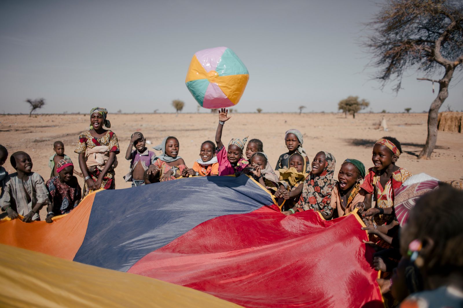 CARE is providing psychosocial support to children in Niger by bringing laughs and fun to those affected by the Diffa crisis. Photo: Ollivier Girard