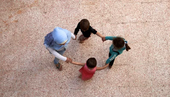 Kids playing in a circle in Syria
