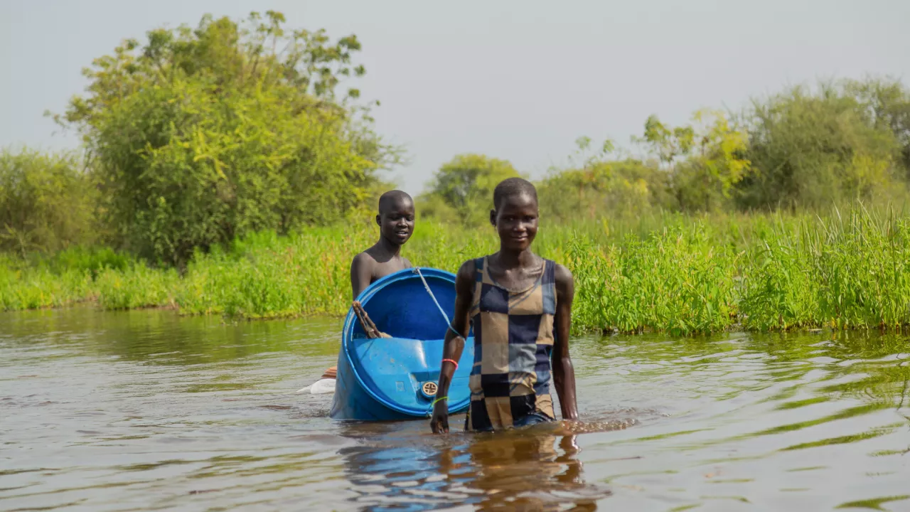 https://www.care-international.org/sites/default/files/styles/media_block_large/public/2022-11/South%20Sudan_floods_young%20women%20crossing%20flooded%20area_RS95549.jpg.webp?itok=j6Pew02f