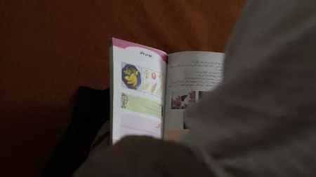 Girl reading book in Afghanistan