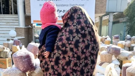 Woman holds baby in Afghanistan