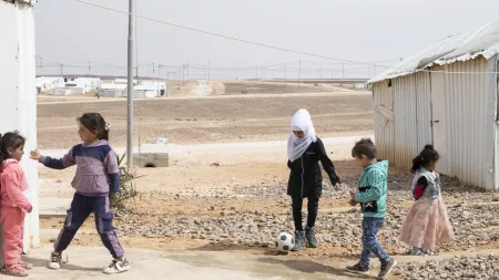 Children playing football in refugee camp in Jordan