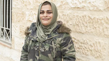 Raeda, a plumber in Jordan, smiling
