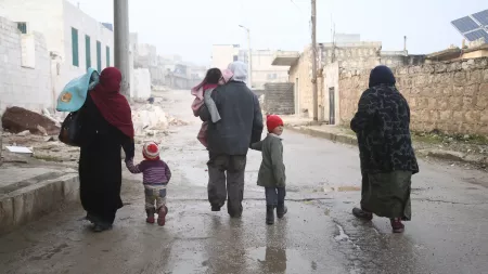 Family walking on the street in Syria