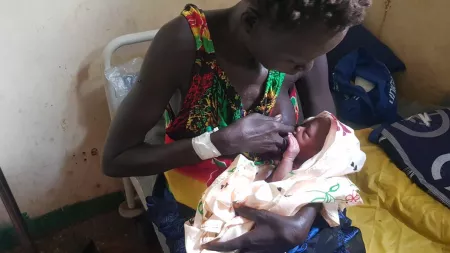 South Sudanese woman Gero breastfeeding her baby