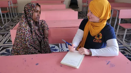 Emergency Communications Officer, Sarah Easter, CARE Germany and CARE Austria is talking to Hamdi Suleman, 14, in a school in southern Somalia.