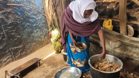 Ardo Dhunkel, 60, cooking lunch in her kitchen in a village in Somalia.