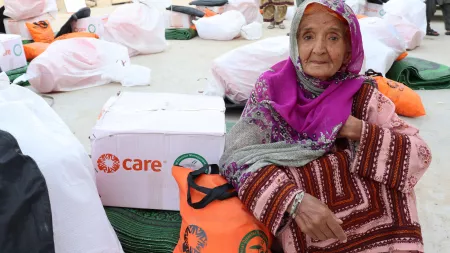 Elderly woman with CARE package in Pakistan