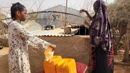 Asha Mohammed and daughter fetching water in Somalia