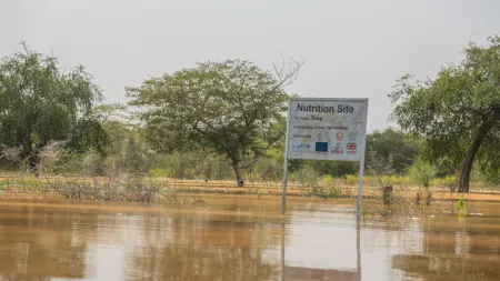 Signpost Nutrition Site partly submerged by floods