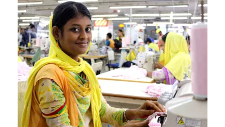 Bangladesh_Factory worker in yellow sewing clothes