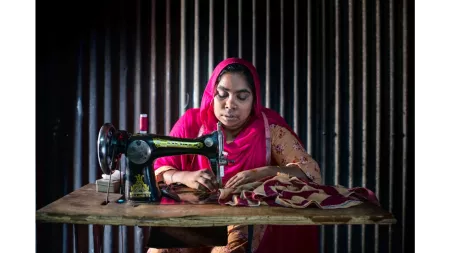 Bangladesh_Woman in pink sari sewing