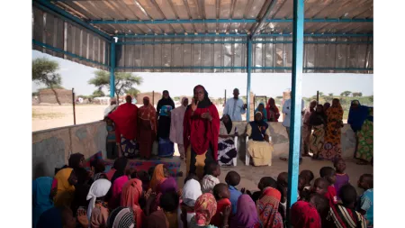 Niger_Woman teaching children in community hall
