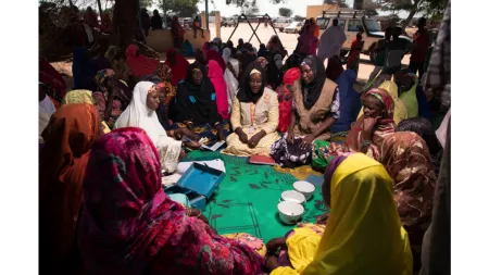 Niger_Women sitting around circle with CARE workers