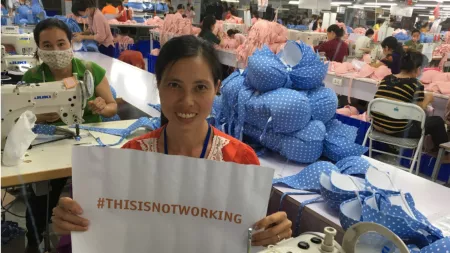 Vietnam_Factory worker holding hashtag sign