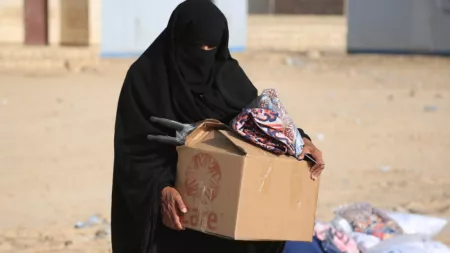 Yemen_Woman receives CARE package