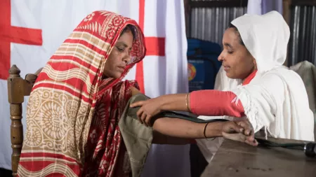 Bangladesh_Doctor checking blood pressure on woman