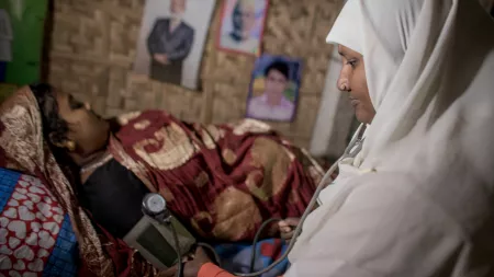 Bangladesh_Doctor performing medical check on pregnant woman
