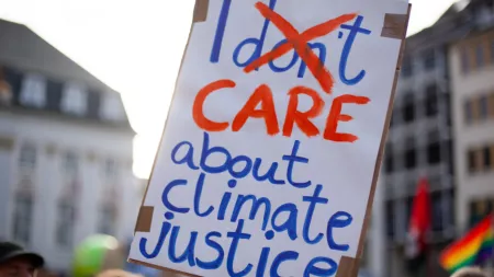 England_Protest poster on climate justice