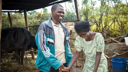 Rwanda_Man and woman holding hands laughing