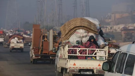 Syria_Cars carrying displaced people out of city with furniture