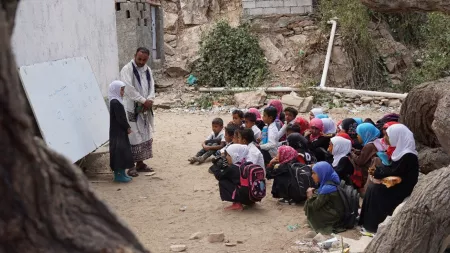 Yemen_Young students sitting under a tree learning