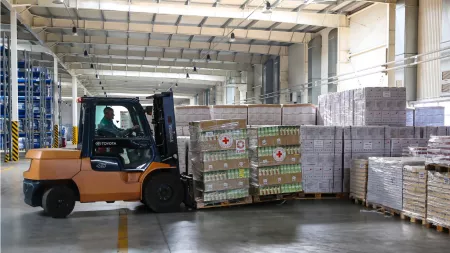 Ukraine_Factory with truck stacking crates of food