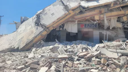 Turkiye_Building that has collapsed on left hand with rubble on the ground