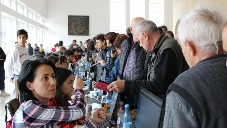 People registering in desks