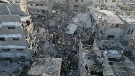 Aerial image of people among rubble