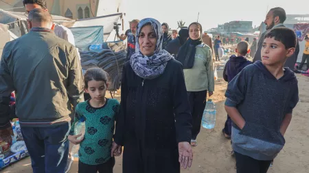 Woman and children walking