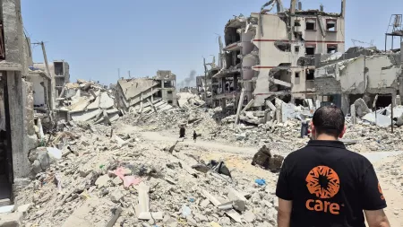 CARE staff amid rubble