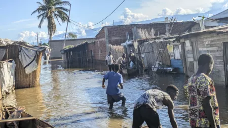 Burundi flood victims wade through submerged village near Lake Tanganyika.