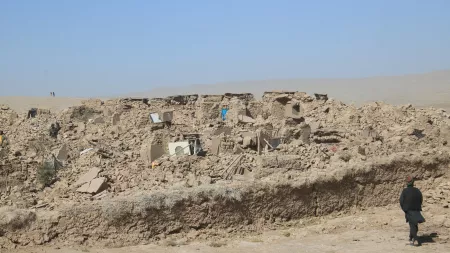 Rubble in deserted area with man standing on the right side
