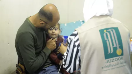 Doctor with father and child