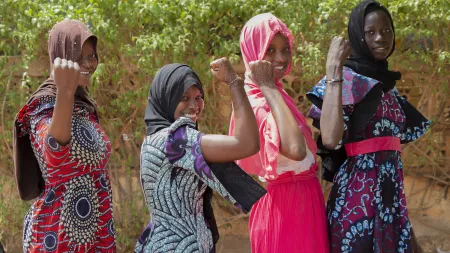 Girls in CARE’s Tipping Point program in Mali show their strength as they advocate for their rights and futures.