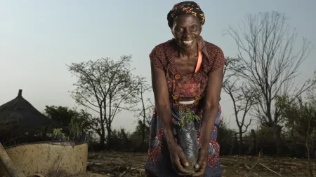 Feeby planting indigenous trees in her garden