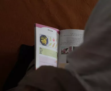 Girl reading book in Afghanistan