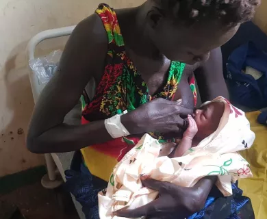 South Sudanese woman Gero breastfeeding her baby