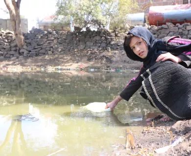 Girl fetching water in Yemen