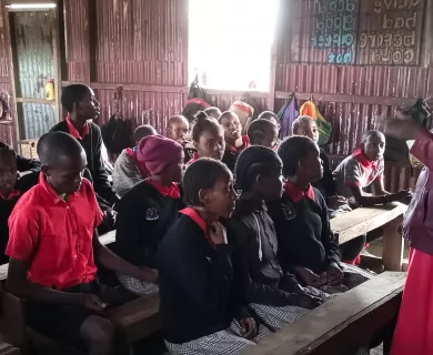 Children with teacher in classroom in Kenya