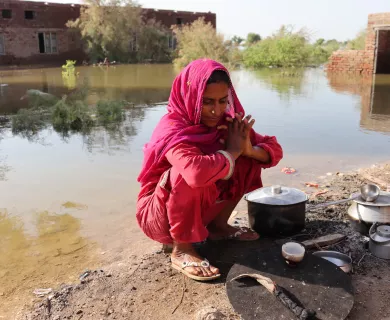 Woman in flooded area in Pakistan
