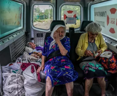 Ukraine_Old women in evacuation car with no back seats