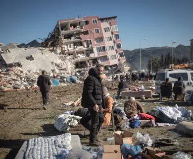 man looking at camera amid rubble