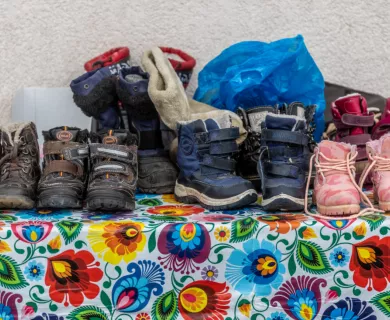 Ukraine_Shoes of children on colourful table cloth