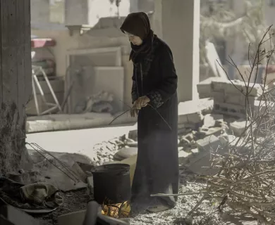 woman cooking woodfire