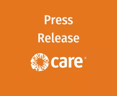 Press release text and CARE's logo over orange background