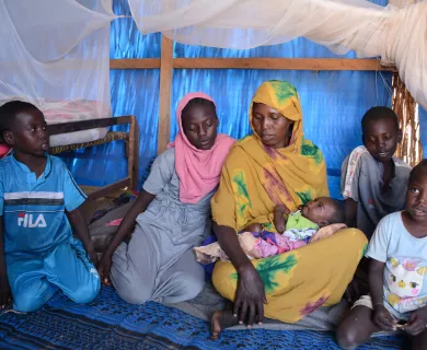 Azila Adam Abakora, a displaced mother of 6 from Sudan with her children in Metche Camp, Chad.